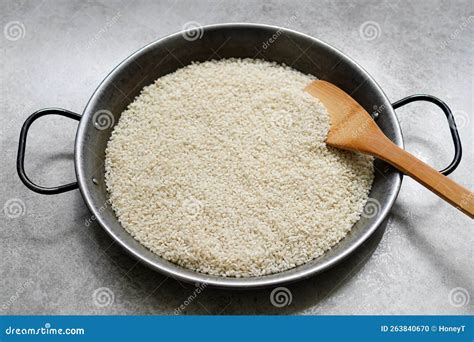 White Rice and Wooden Rice Scoop in Paella Pans Stock Photo - Image of ...