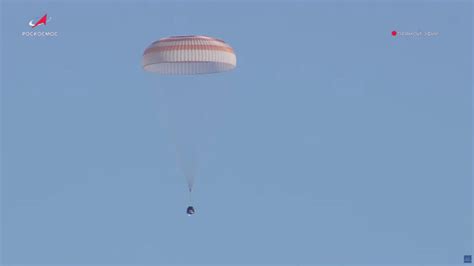 Russian cosmonauts touch down in Soyuz capsule after record-breaking ...