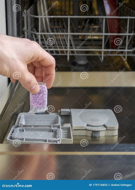Loading the Soluble-coated Tablets in the Dishwasher. Powder ...