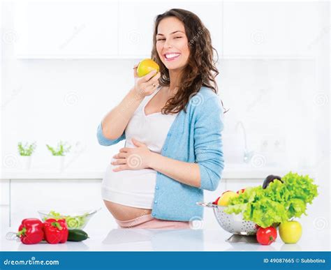 Pregnant Young Woman Eating Apple Stock Image - Image of care, abdomen: 49087665