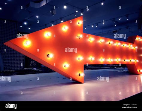 Big red arrow with lights, USA Stock Photo - Alamy