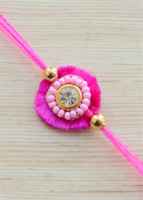 Get Simple Pink Beaded Kundan Stone Rakhi at ₹ 159 | LBB Shop