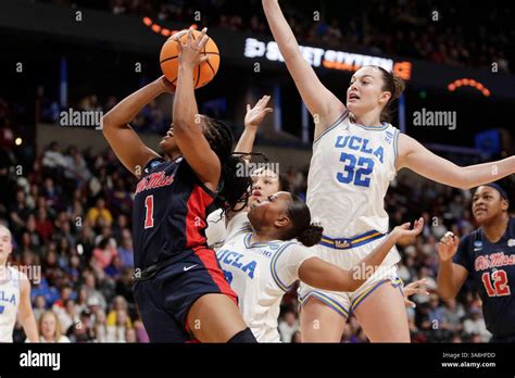 Mississippi guard KK Deans (1) shoots next to UCLA forward Angela ...