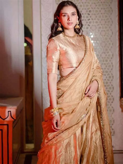 Aditi Rao Hydari exudes royalty and elegance in a stunning golden silk ...
