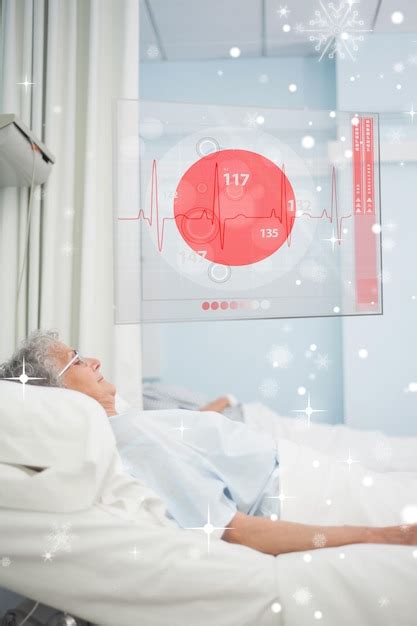 눈이 내리는 미래형 Ecg 데이터 디스플레이와 함께 병원 침대에 누워 있는 환자 | 프리미엄 사진