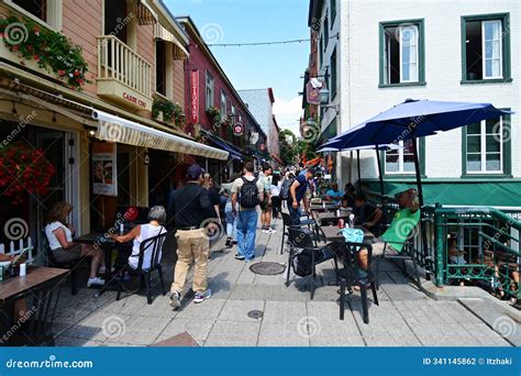 Pepole Wolking in the Streets of Historic Quebec City are in the Walled Section of the Capital ...