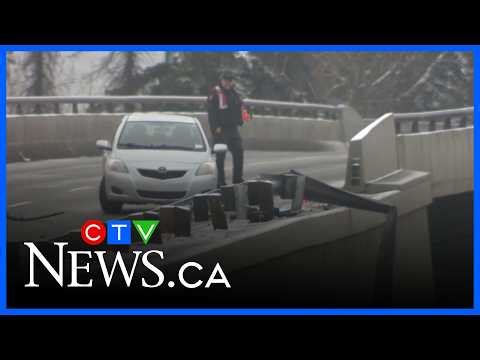 Serious crash sends car falling onto road below