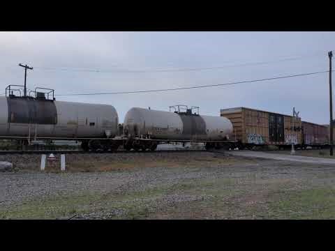 CSX 1875 P&LE heritage unit leads a long mixed freight train through downtown Hamlet, N.C.