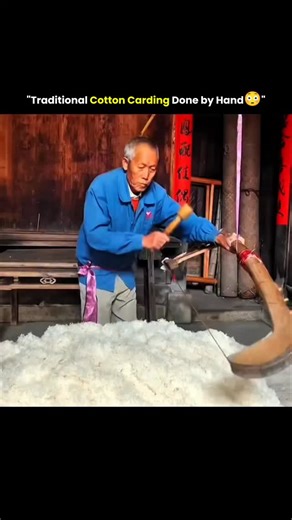 Innoverse on Instagram: "Traditional cotton carding is a craft built on rhythm, patience, and precision. With practiced hands, raw cotton is gently combed to separate tangled fibers, remove impurities, and align each strand into a soft, uniform layer ready for spinning. Every movement is deliberate, relying on feel rather than machines, and the result is a texture that reflects both skill and experience. This process is more than preparation—it’s a living connection to generations of textile kno