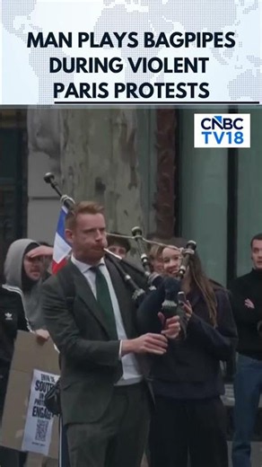MOMENT: Man Plays Bagpipes During Violent Paris Protests | France Protest | N18G