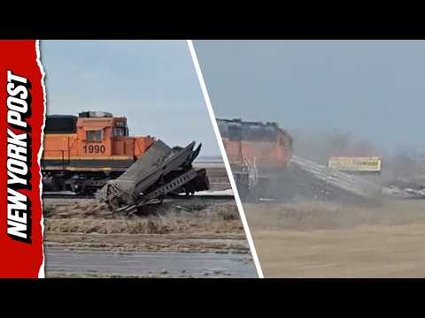 Driver Shocked When Freight Train Obliterates Stalled Trailer, Dragging it Along the Tracks