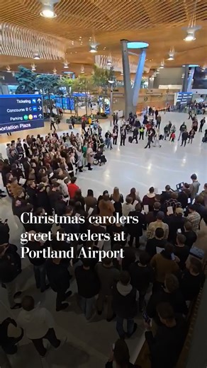 Dozens of Christmas carolers gathered at Portland International Airport to greet and send travelers off with a holiday song, "O Holy Night." | Washington Post