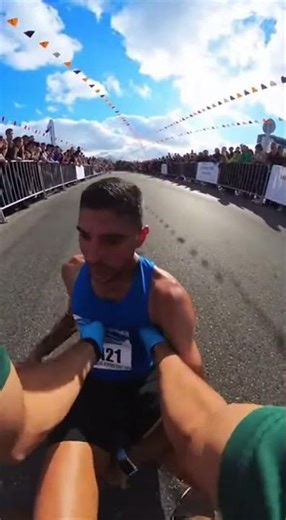 EMT Helps Runner Cross Finish Line