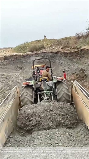 Shoving the Rubble: How a Tractor’s Rear Bucket Loads a Dump Truck