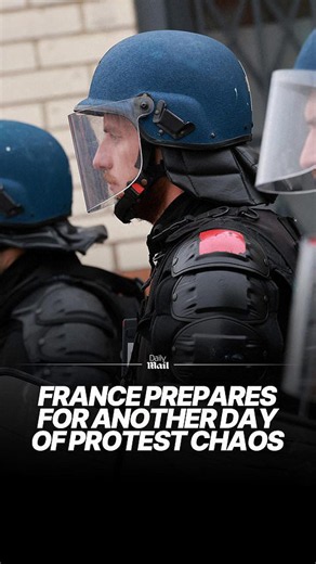 Paris boards up shops and 70,000 riot police take to the streets