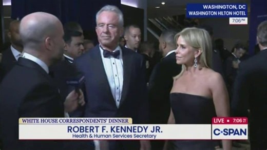 Wait. Who's that woman with Kennedy?