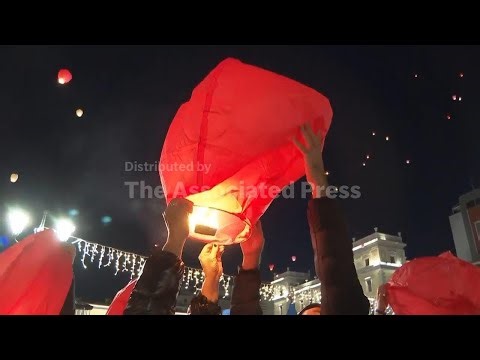 Hundreds gather in central Athens to release paper lanterns into the sky during the Night of Wishes