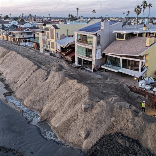 Photos show record-breaking tides flooding homes, roads in California
