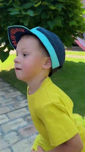 Brotherly Love: Sharing Hats on a Hot Summer Day 🧢 ☀️