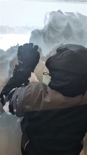 Blizzard blocks front door with heavy snow in Newfoundland, Canada