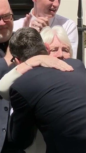 New PM's long hug from his mum
