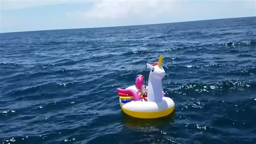 They thought it was just a guy on a unicorn until they saw the shark pulling him, caught on camera