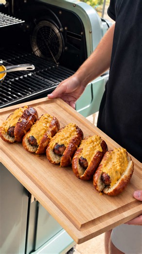 Bacon Wrapped Beer Brats with SauerKraut Beer Cheese on a Pretzel Bun? OH YA! @Smithfield Brand Porktoberfest has never tasted this good #SmithfieldPartner #WeSpeakPork #Oktoberfest Bacon Wrapped Beer Brats with Sauerkraut Beer Cheese: 5 Smithfield beer brats (1 package) 1 14oz package Smithfield hometown original bacon 5 pretzel buns 4 tbsp butter 16oz cheddar cheese, shredded 1 tbsp dijon mustard 2 tsp worcestershire sauce 1 1/2 cups sauerkraut (more or less depending on preferred tang and con