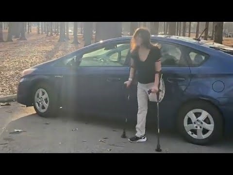 Amputee lady crutches user: walking with mobility as supportive guide