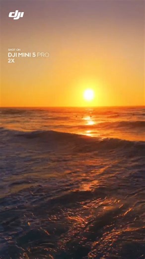 1x vs. 2x zoom, which one is your pick? 🤩 Golden‑hour waves and a sunset horizon, all captured with #DJIMini5Pro. With flagship‑level imaging packed into a mini body, it turns everyday scenes into cinematic memories. 🌅✨ 🎥: maia.visuals #DJI #MiniCameraDrone #AerialPhotography #SunsetVibes #DroneShots #CinematicView #ExploreWithDJI | DJI