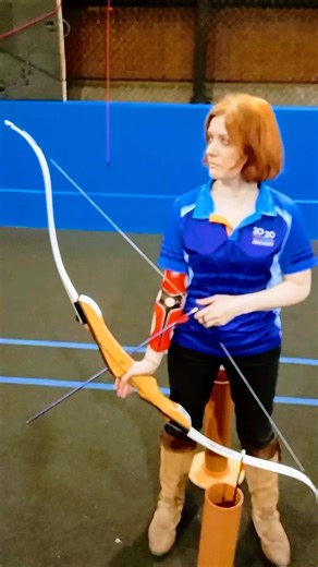 Archery Instructor Demonstrates Techniques to Beginners