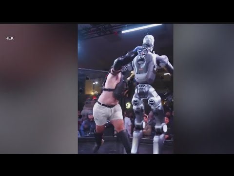 Human takes on humanoid robot in MMA-style fight