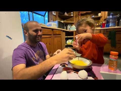 Everly makes breakfast - Hiking in the rain 