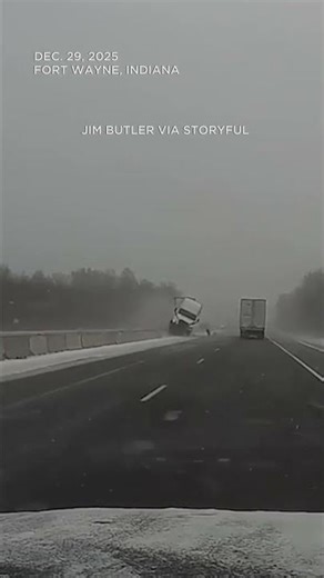 Semi-truck launches over highway barrier