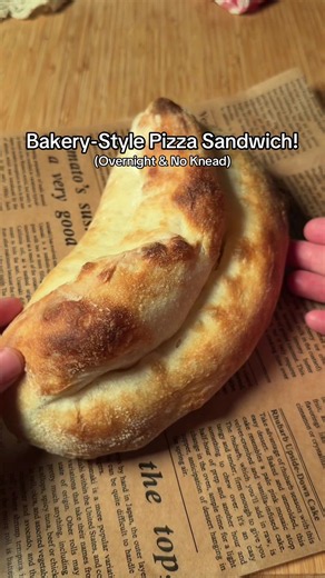 No-Knead Pizza Sandwich Ingredients: * 150g flour (1¼ cups) * 105g water (about 7 tbsp) * ½ tsp yeast * 1 tsp sugar * 1 tsp salt * 1 tbsp olive oil Instructions: 1. In a bowl, mix yeast, sugar, and water. Add flour, salt, and oil, then coil fold several times until everything is combined. 2. Cover and let rest for 20 minutes, then coil fold again. Cover and refrigerate overnight. 3. The next day, remove the dough from the fridge and let it sit at room temperature for 30 minutes. 4. Generously fl