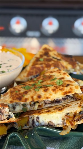 @jess__ferrin is bringing fall flavors to the Blackstone with her Harvest Quesadillas! 🍁 Filled with seasoned butternut squash, sautéed onions, black beans, and melted pepper jack cheese, these quesadillas are packed with flavor. Serve them with a homemade chipotle crema for dipping! Ingredients 1 butternut squash, peeled and diced into ½-inch cubes 1 medium onion, thinly sliced 1 can black beans, drained and rinsed 2 cups shredded pepper jack cheese 3 large flour tortillas 2 tablespoons olive 
