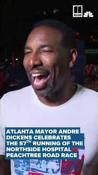 Atlanta Mayor Andre Dickens celebrates the Northside Hospital Peachtree Road Race