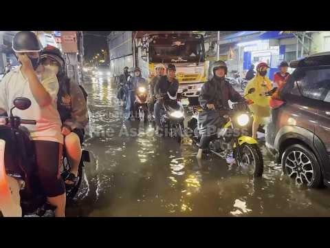 Rush hour traffic caught up in flood waters in Vietnam’s Ho Chi Minh City