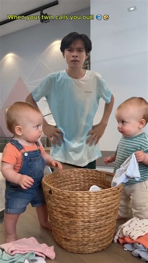 Cute twins helping with laundry reaction! 🧺👶