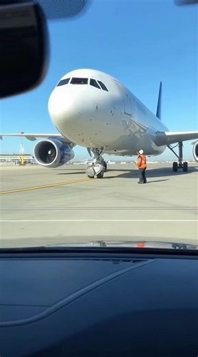 Caught On Dashcam: Airbus Engine Explodes After Sucking In Loose Baggage Cart ------------ ----------- ------------- This shocking dashcam footage, captured from a staff vehicle at the perimeter of Toronto Pearson Airport, shows the terrifying moment a routine taxi turns into a major emergency. Under the bright midday sun, an Airbus jet is seen slowly making its way toward the runway for takeoff. The scene starts calmly until a stray baggage cart, caught in the powerful jet blast, begins to drif