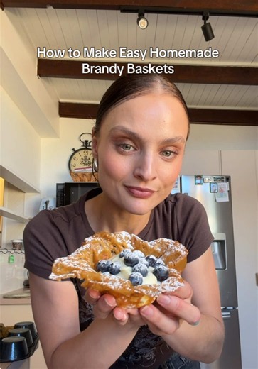 Homemade Brandy Baskets :) Ingredients: Brandy baskets: 50g butter ¼ cup golden syrup ¼ cup brown sugar 1 tbsp brandy (optional, or use 1 tsp vanilla) Zest of ½ lemon 1 tbsp lemon juice ¼ cup plain flour, loosely packed (you may need a little less) ¼ tsp ground ginger Cream filling: 600ml thickened cream 1 tsp vanilla 2 tbsp icing sugar To serve: Fresh fruit of your choice Extra icing sugar for dusting Method: 1. Chuck the butter, golden syrup and brown sugar into a microwave-safe bowl. Microwav