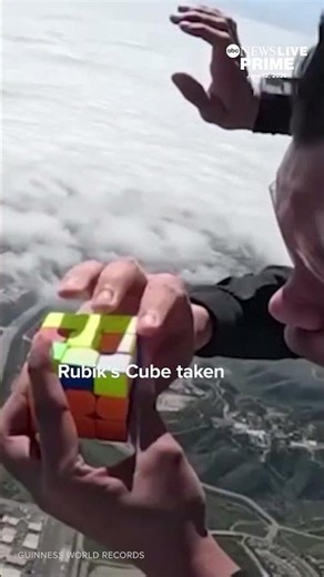 A man sets a world record by solving a Rubik’s Cube while skydiving from 13,000 ft over California.