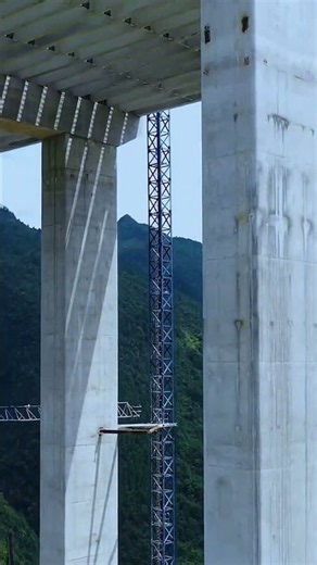 A massive viaduct takes shape deep in mountain canyons