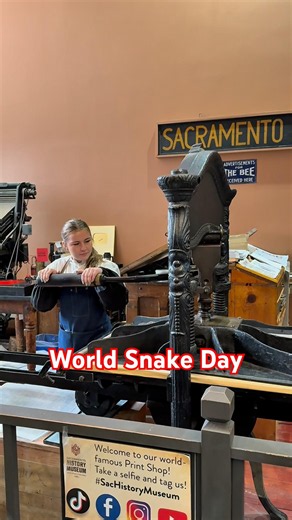 Printing a linoleum cut of a snake for World Snake Day (July 16)