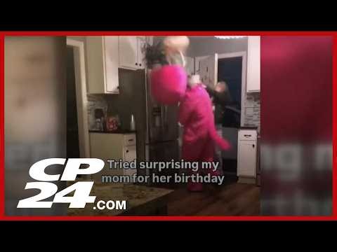 ‘Barney down!’: Mother hits son over the head with purse after attempted birthday surprise