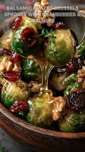 Brussels sprouts halved. Toss with olive oil, salt, pepper. Roast at 425°F for 20–25 minutes, then glaze with balsamic and honey. These Brussels sprouts turn crispy-edged, tender inside, sweet-tangy, and nutty with pops of cranberry. Ingredients ➤ 1 lb Brussels sprouts, trimmed and halved ➤ 2 tbsp olive oil ➤ 1/2 tsp salt ➤ 1/4 tsp black pepper FULLL Recipe in First Cօʍʍеոτ 👇👇 | Nessy Recipes
