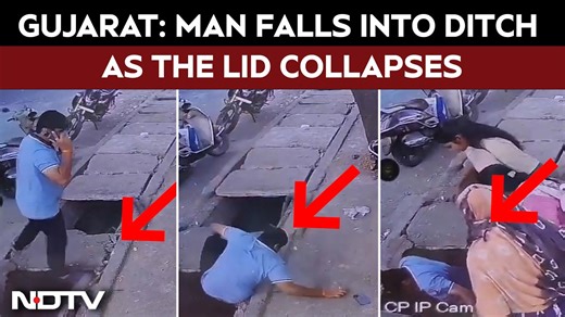 Gujarat Man Falls Into Ditch As Lid Collapse While He Is Talking On Mobile