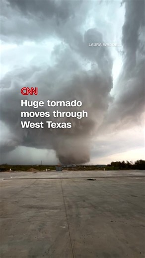 A massive tornado was filmed looming behind some houses in Fort Stockton, Texas, and left debris in the streets — including downed branches and fallen poles. #tornado #texas #weather