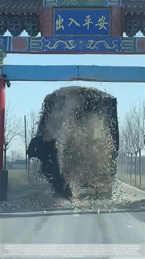 The gatehouse remains intact, but the cargo on the truck's roof has fallen off.