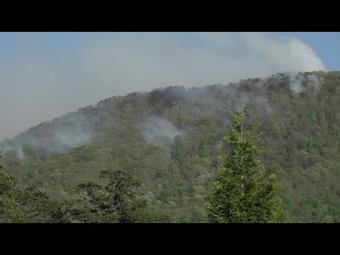 Crews battle fire on House Mountain