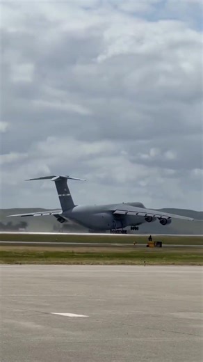 Footage shows a Lockheed C-5 Galaxy strategic transport aircraft taking off. This aircraft